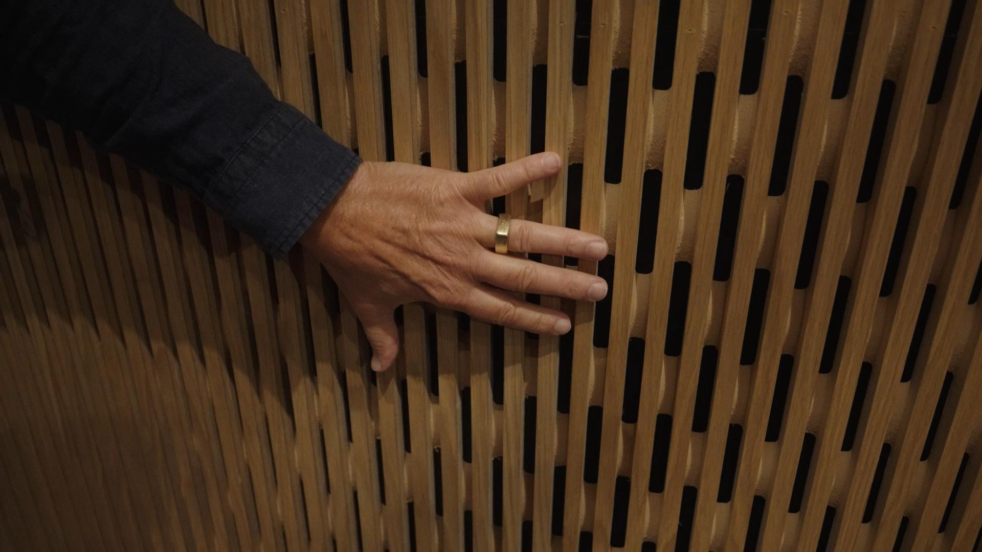 Custom acoustic slat wall panels installed in modern office conference room